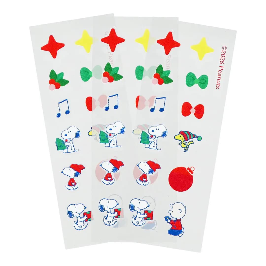 Three sheets of blemish patches shaped as stars, bows, holly, music notes, ornament, Snoopy and Charlie Brown.