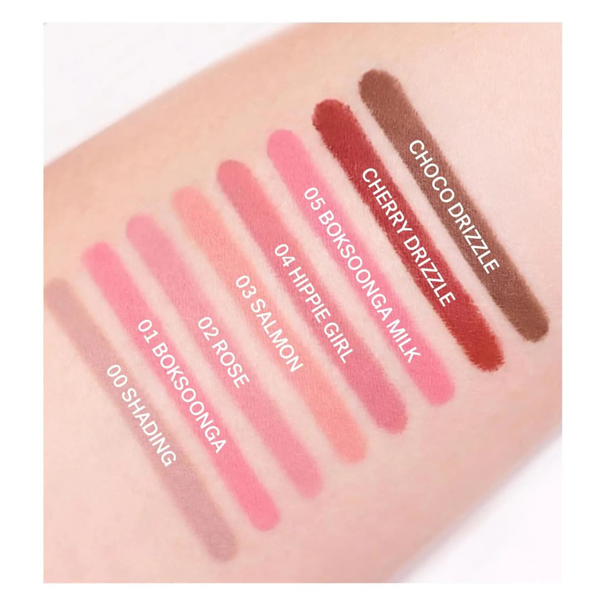 Arm swatches of seven Lip Smudger shades labeled from Shading to Choco Drizzle in diagonal stripes