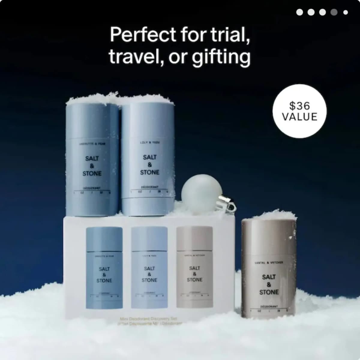 Salt & Stone deodorant set staged on snow with ornaments, labeled 'Perfect for trial, travel, or gifting'