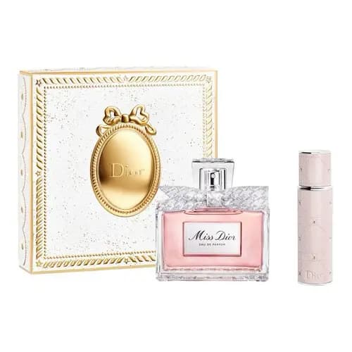 White and gold medallion box with pink Miss Dior Eau de Parfum bottle and quilted pink travel spray