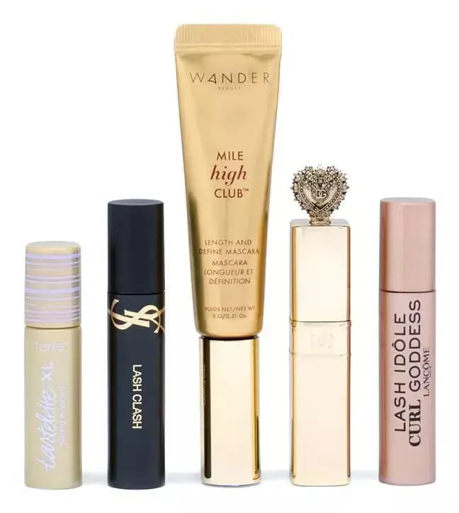 Five gold, black and pink minis: Tarte tartelette XL, YSL Lash Clash, Wander Mile High Club, a heart-cap tube