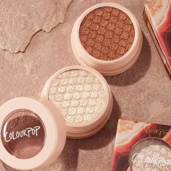 Close-up of two ColourPop Super Shock Shadows in copper and champagne from the Rock On collection