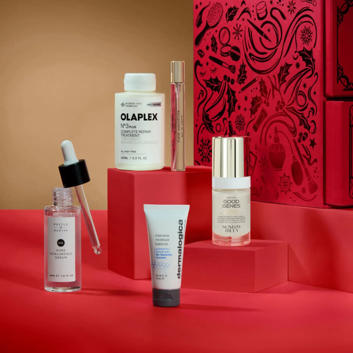 Pestle & Mortar serum, Olaplex No.3 Plus, Ex Nihilo vial, Dermalogica tube and Good Genes on red blocks by the chest