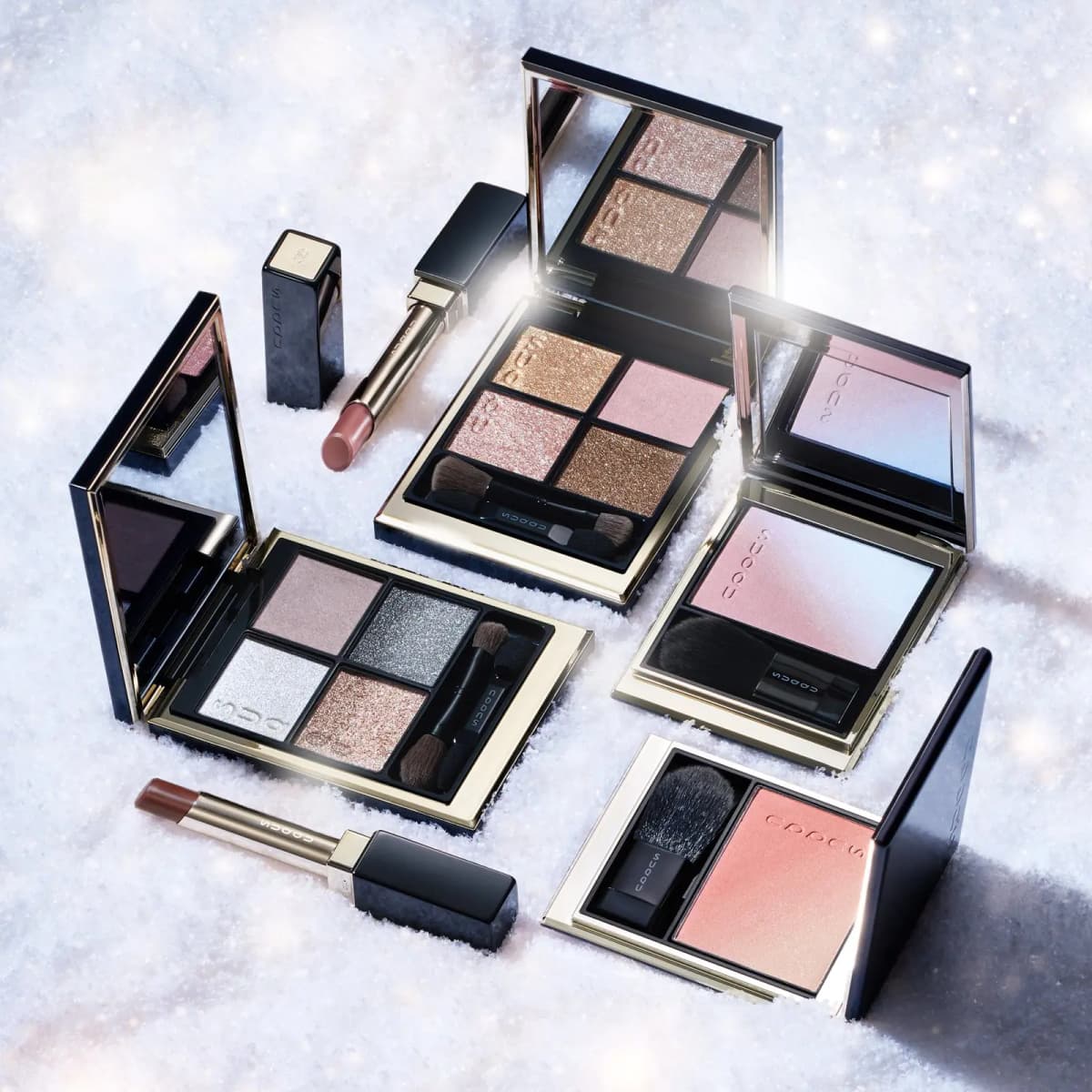 SUQQU Winter Colour Collection 2026 eyeshadow palettes, blushes and lipsticks arranged in sparkling snow