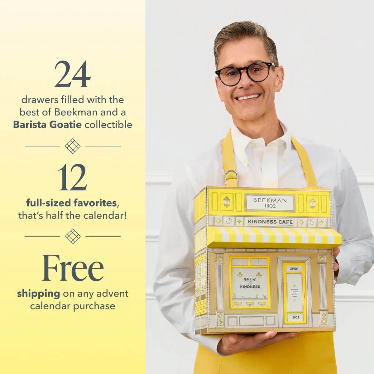 Smiling person in a yellow apron holds the closed Kindness Cafe box beside text on 24 drawers, 12 full sizes and free shipping