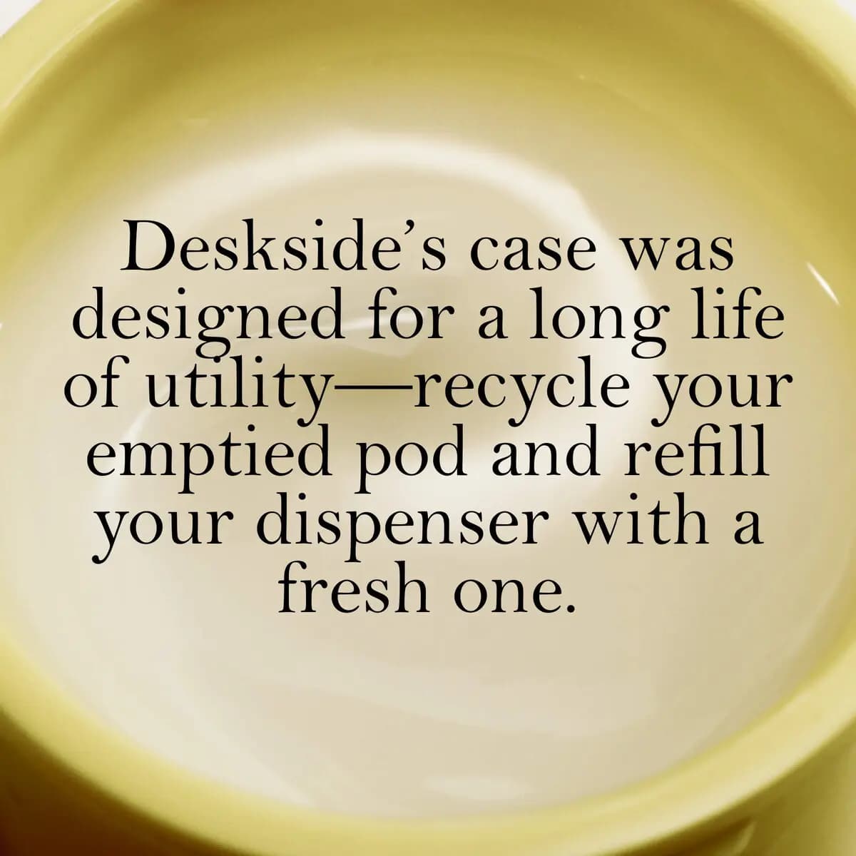 Close-up inside an empty yellow pod overlaid with text about the case's long life and refilling