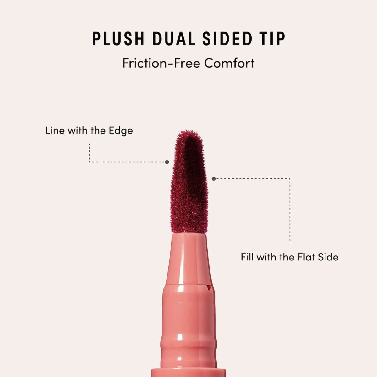 Close-up of a burgundy plush dual-sided tip: edge for lining, flat side for filling, on a pink KISS NEW YORK pen