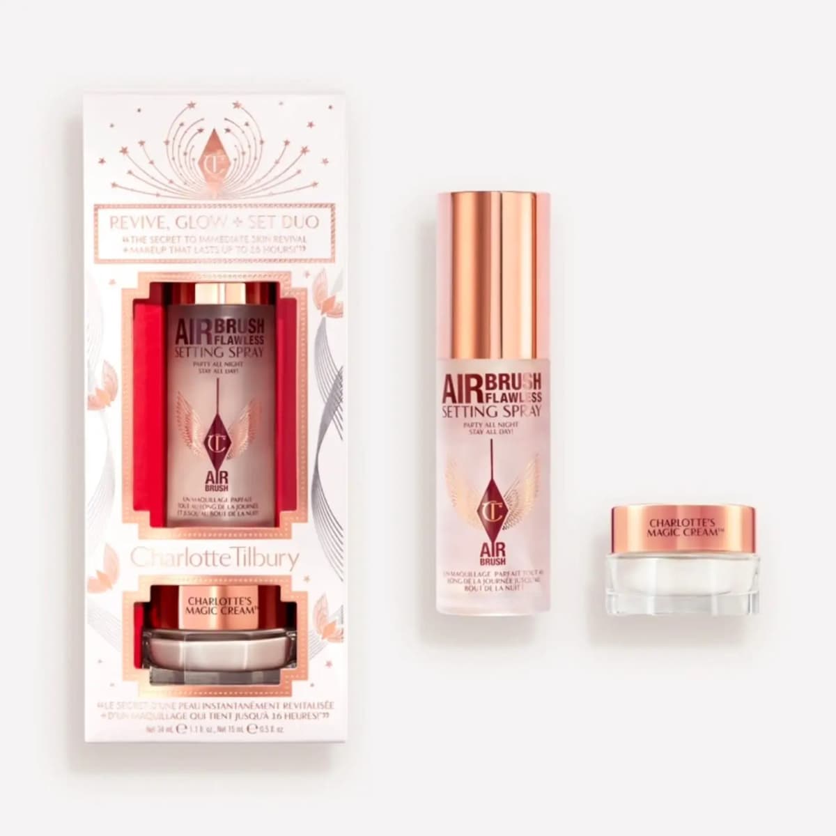 Revive, Glow + Set Duo: white box with Airbrush Flawless Setting Spray and a jar of Charlotte's Magic Cream
