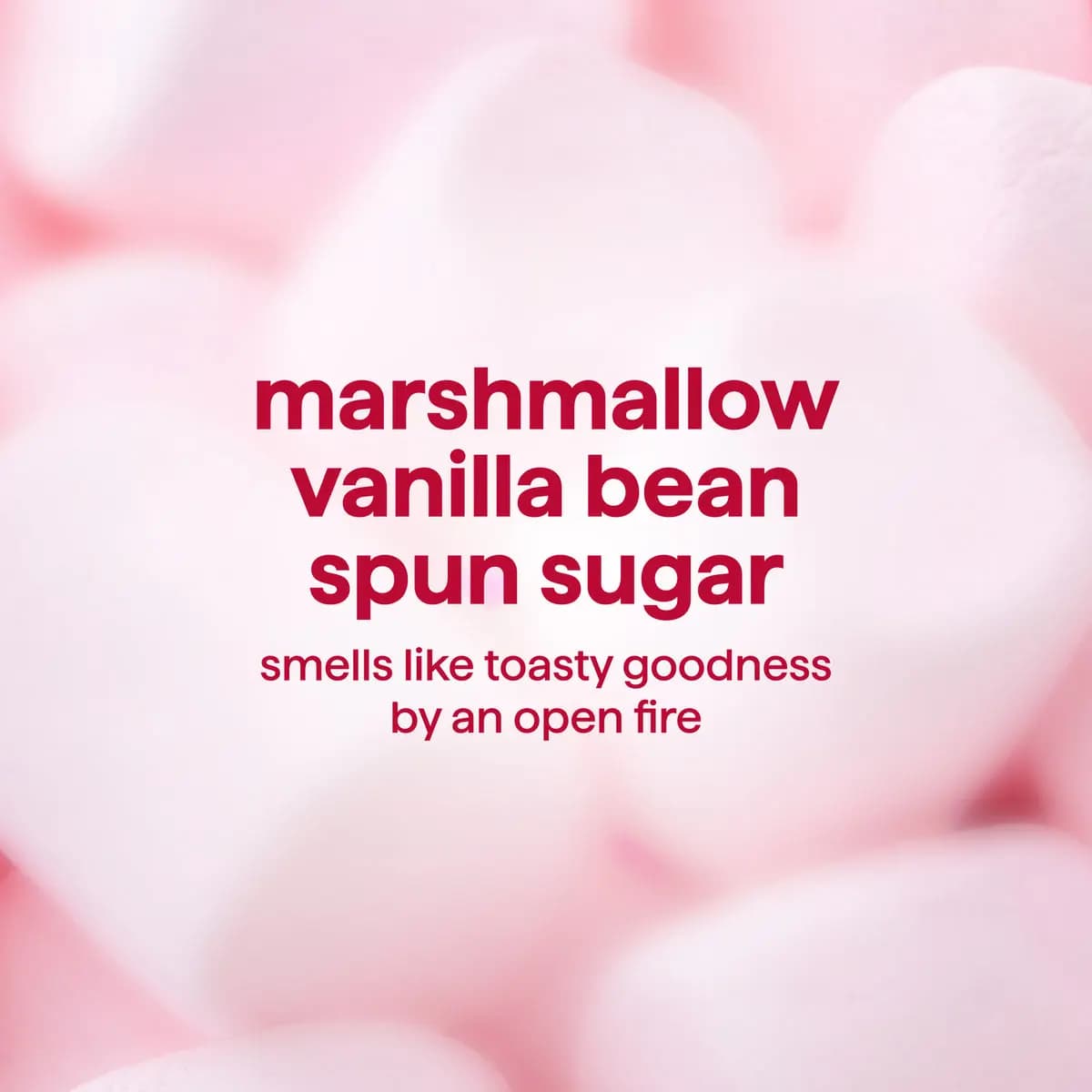 Soft pink marshmallow backdrop with red text "marshmallow, vanilla bean, spun sugar" and a toasty open fire scent line
