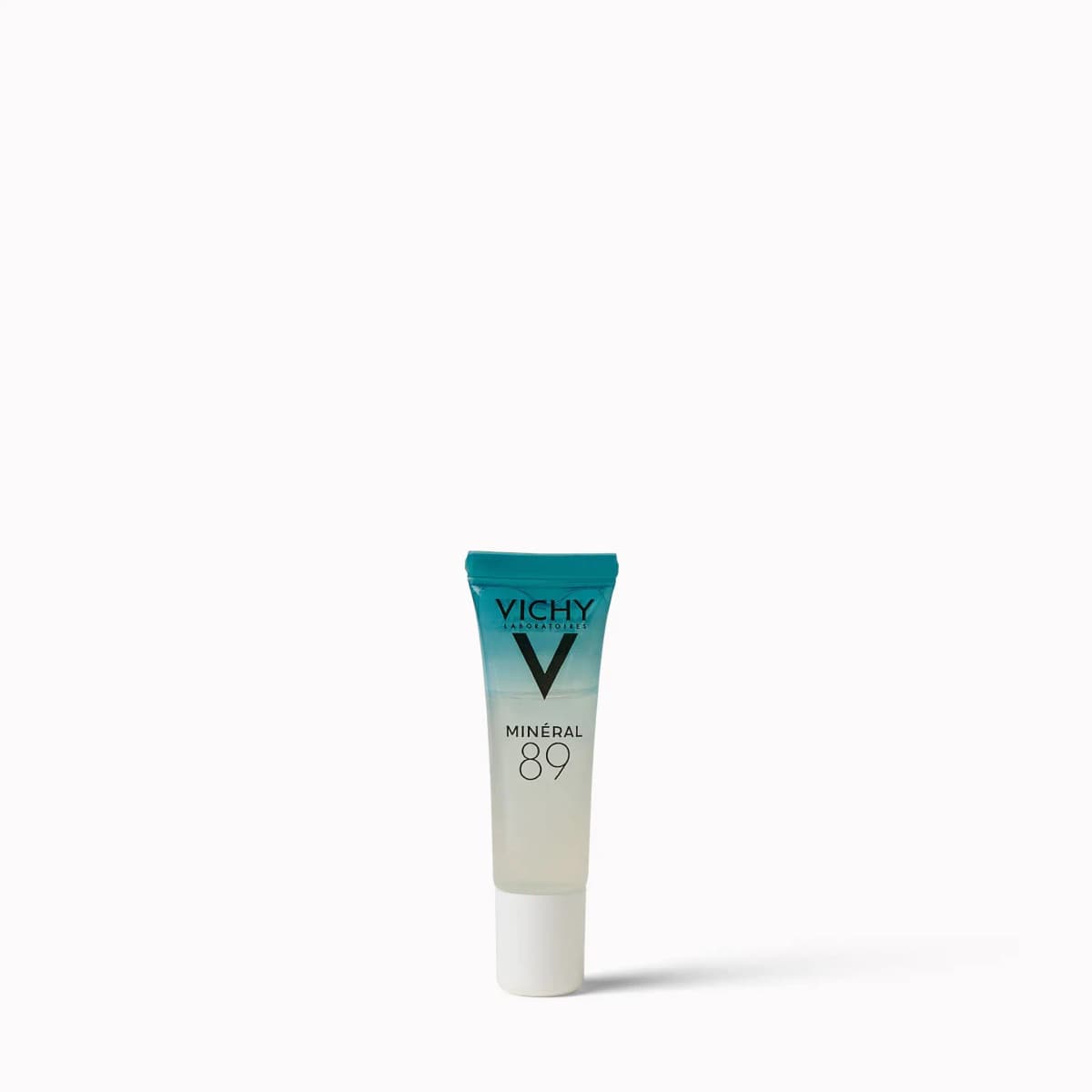 Small Vichy Minéral 89 tube with teal-to-clear gradient and white cap on a white background