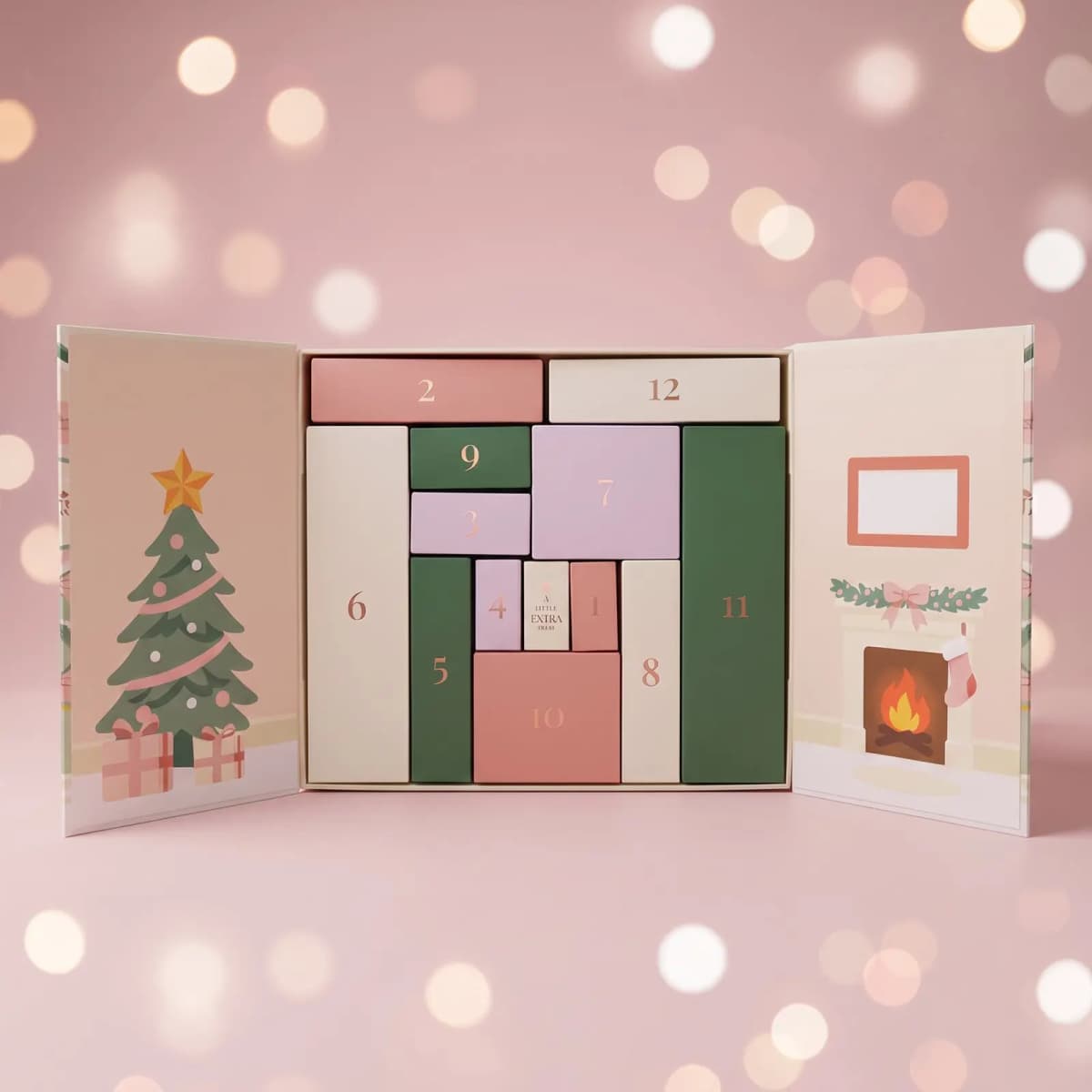 Open FFS advent calendar showing 12 numbered pink, green and cream boxes plus a 'little extra treat' door
