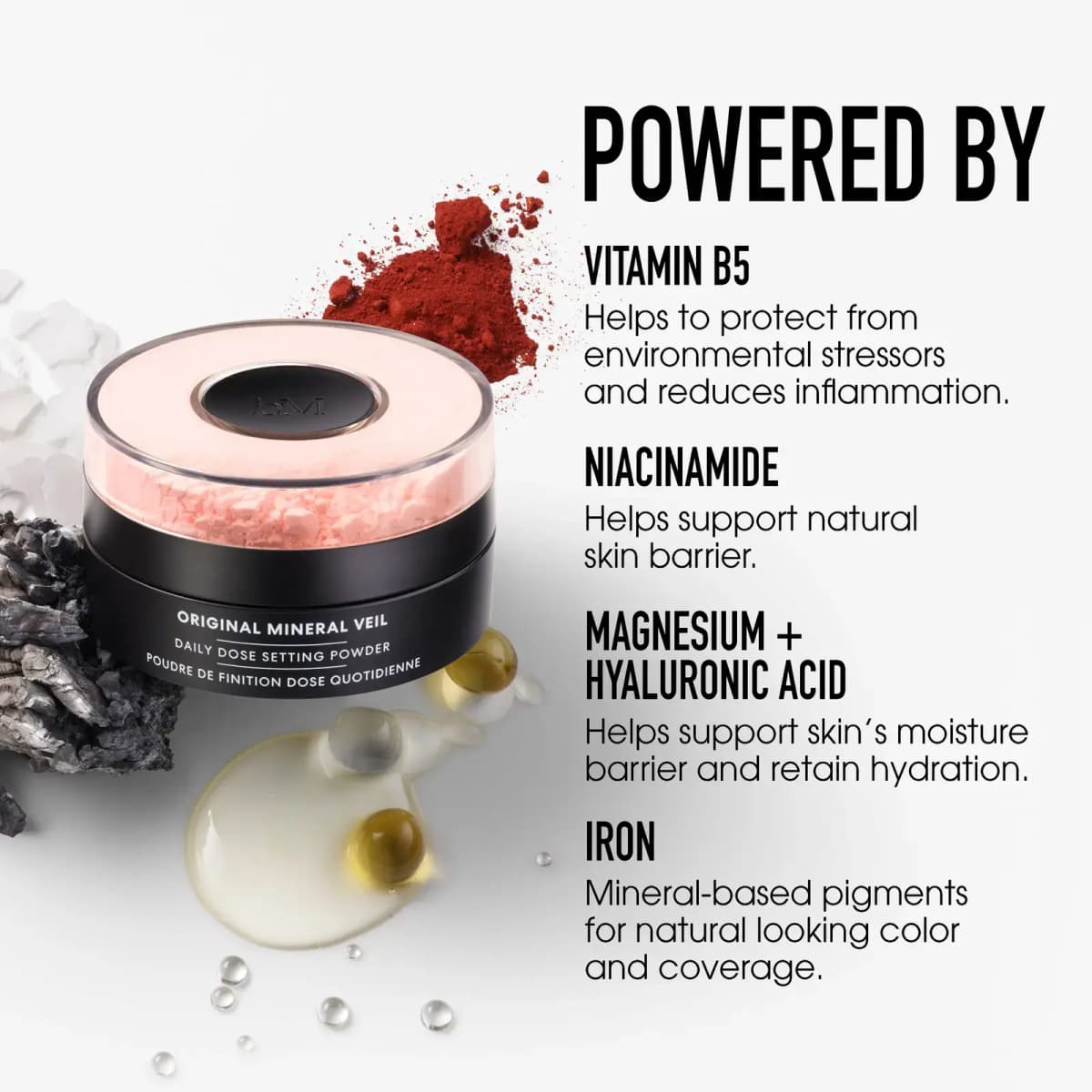 Pink powder jar with red iron pigment, mineral rock and oil drops listing vitamin B5, niacinamide and iron
