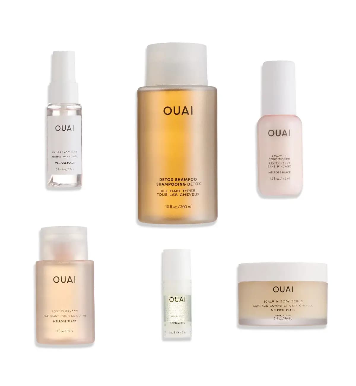 Six OUAI products on white: Detox Shampoo, fragrance mist, leave-in conditioner, body cleanser, hair oil, scalp scrub