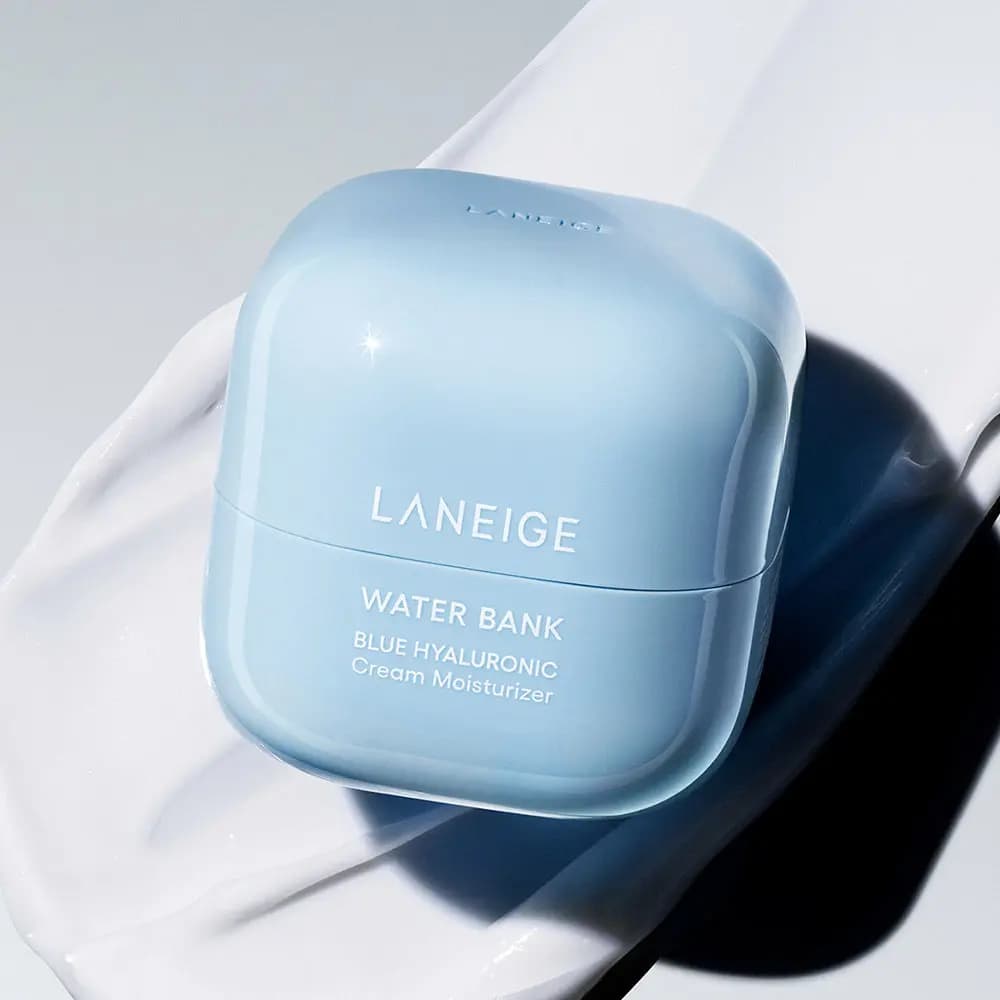 Light blue LANEIGE Water Bank Blue Hyaluronic Cream Moisturizer jar resting on a white cream swatch