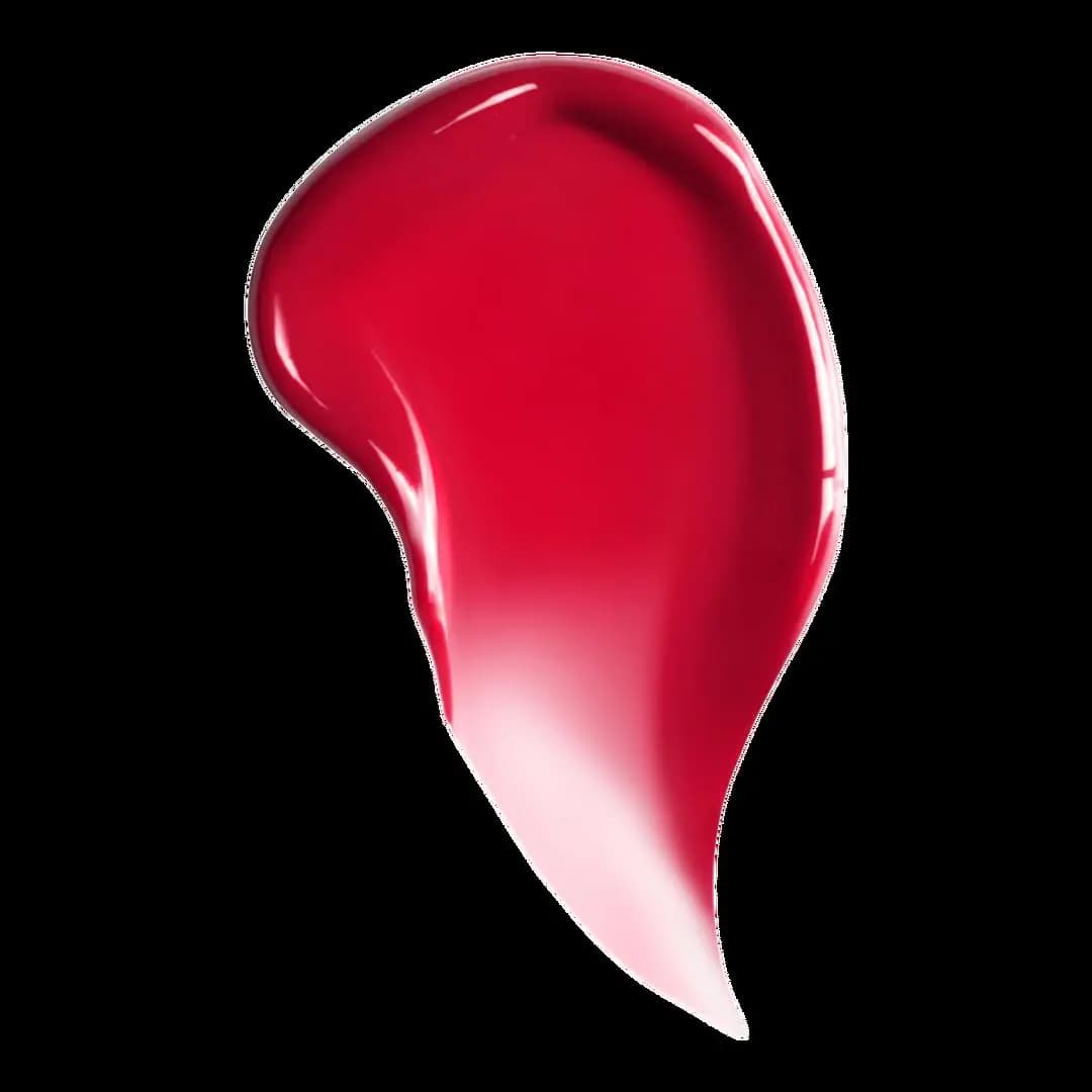 Glossy bright red lip tint swatch fading to a sheer pink edge on black