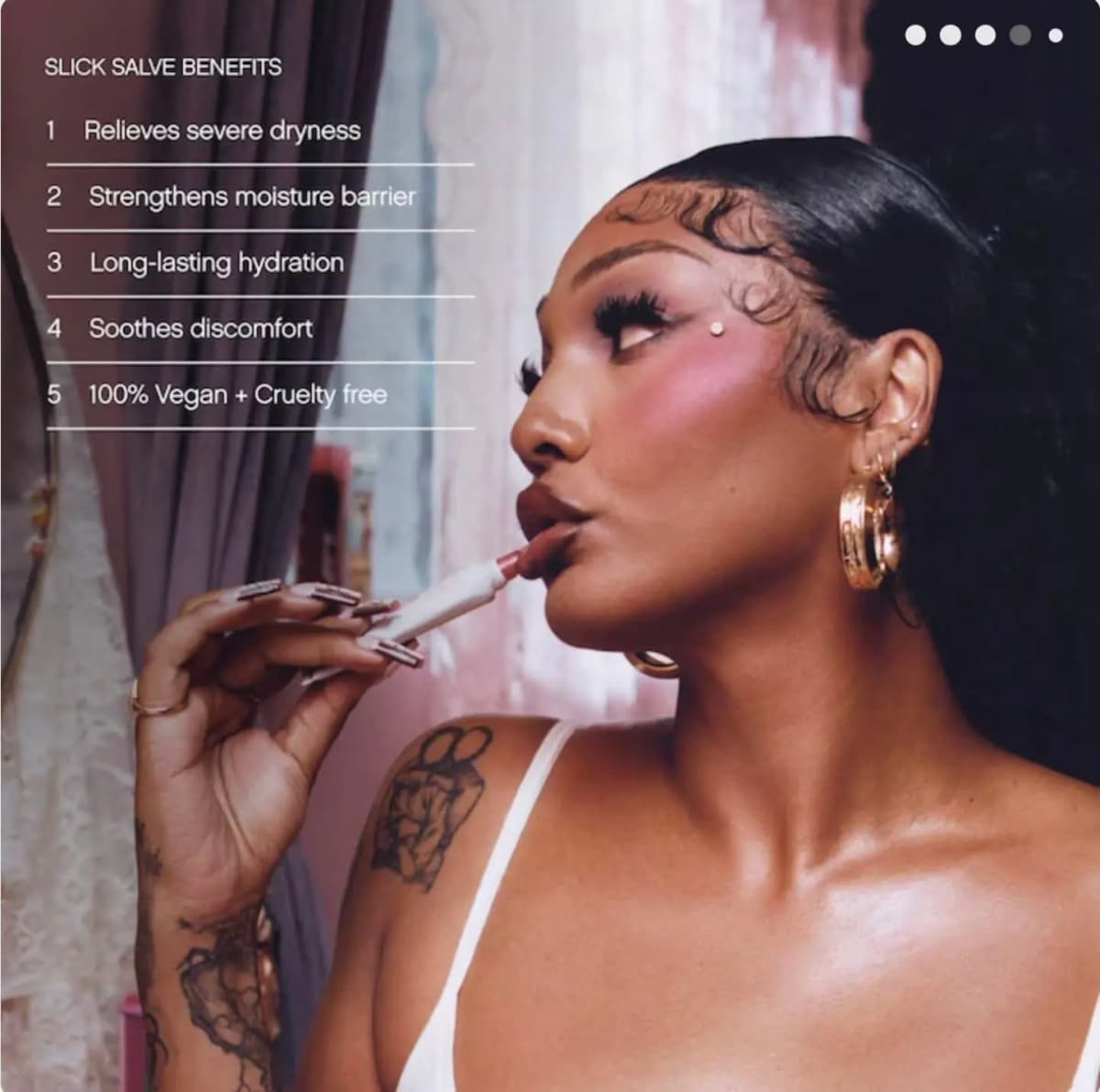 Model applies a glossy lip balm while Slick Salve benefits are listed, including relief for severe dryness