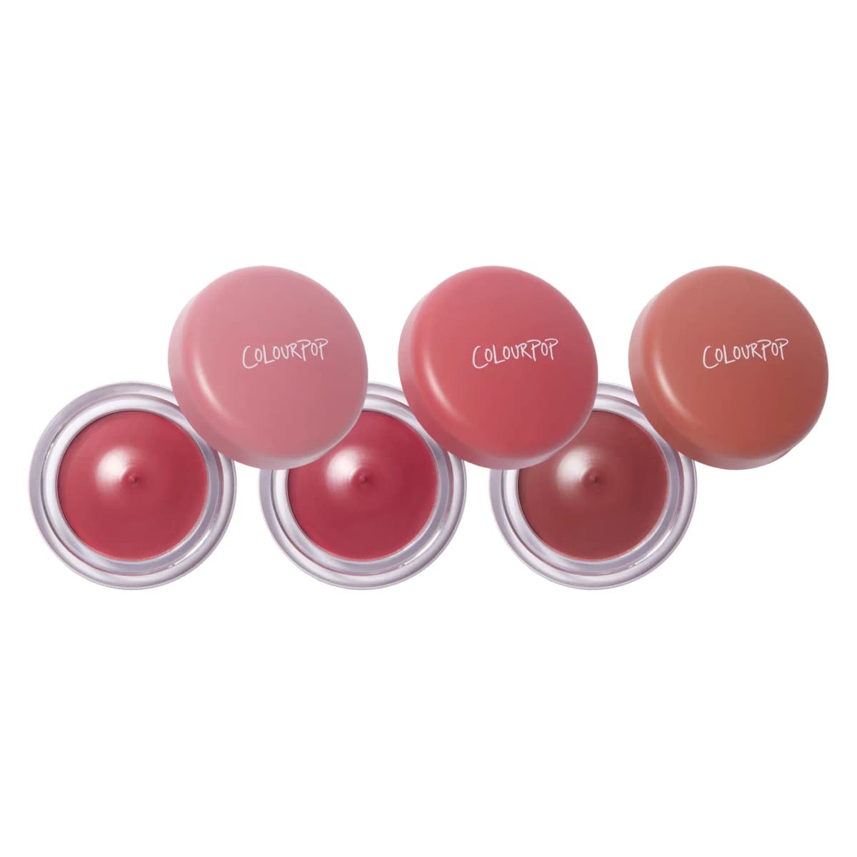 Three open ColourPop pots in rose, raspberry and brick red with pink, coral and peach lids on white