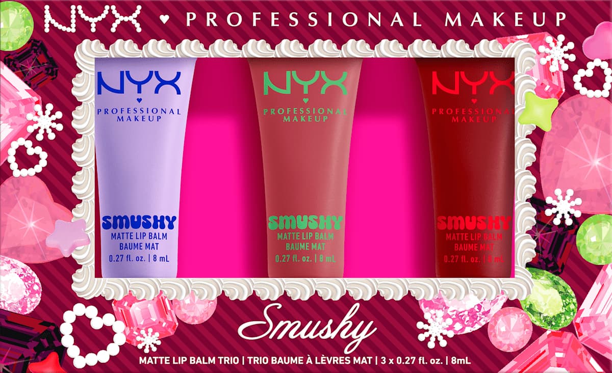 NYX Smushy Matte Lip Balm Trio in lilac, nude and red squeeze tubes inside pink and cream gem-framed box.