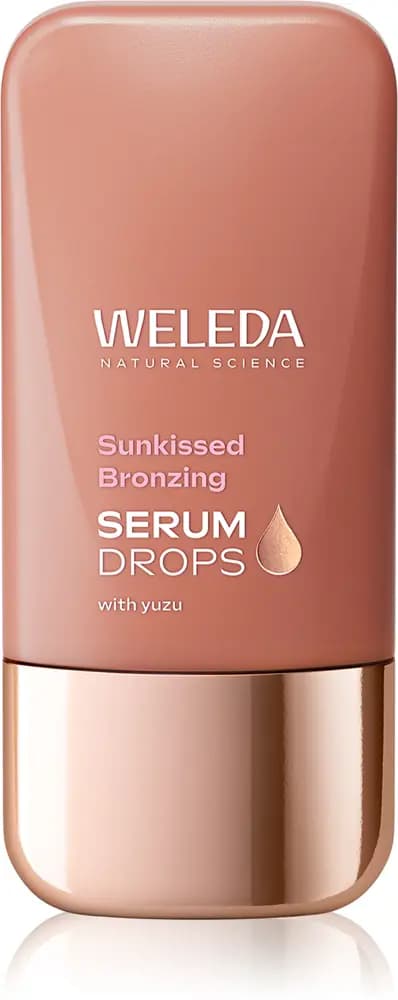 Weleda Sunkissed Bronzing Serum Drops with yuzu in a terracotta-pink bottle with a rose-gold cap