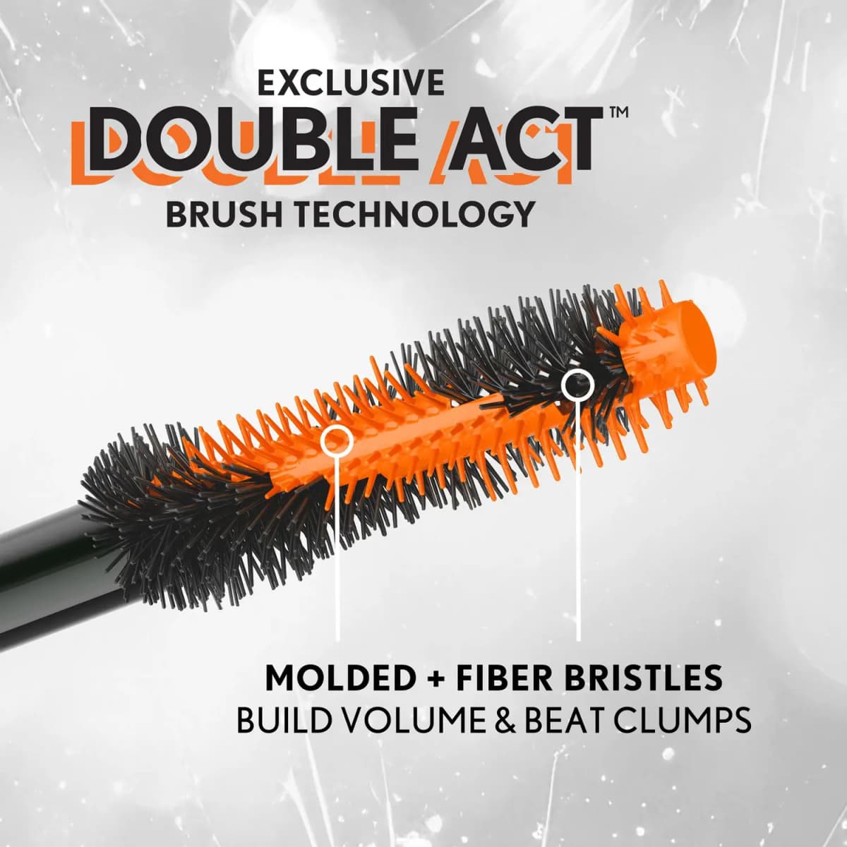 Close-up of the Double Act brush showing orange molded and black fiber bristles that build volume and beat clumps
