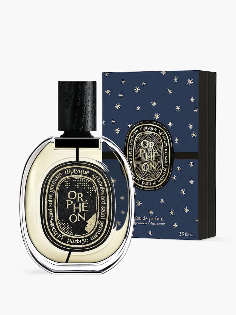 Orphéon bottle with gold dotted label and profile silhouette beside its starry navy box