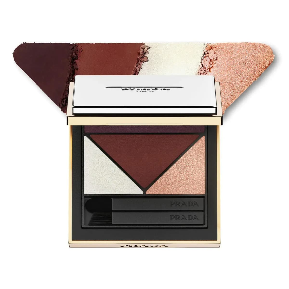 Dimensions palette in gold-trimmed case with plum, mahogany, pearl white and peach shimmer shadows above triangle swatch