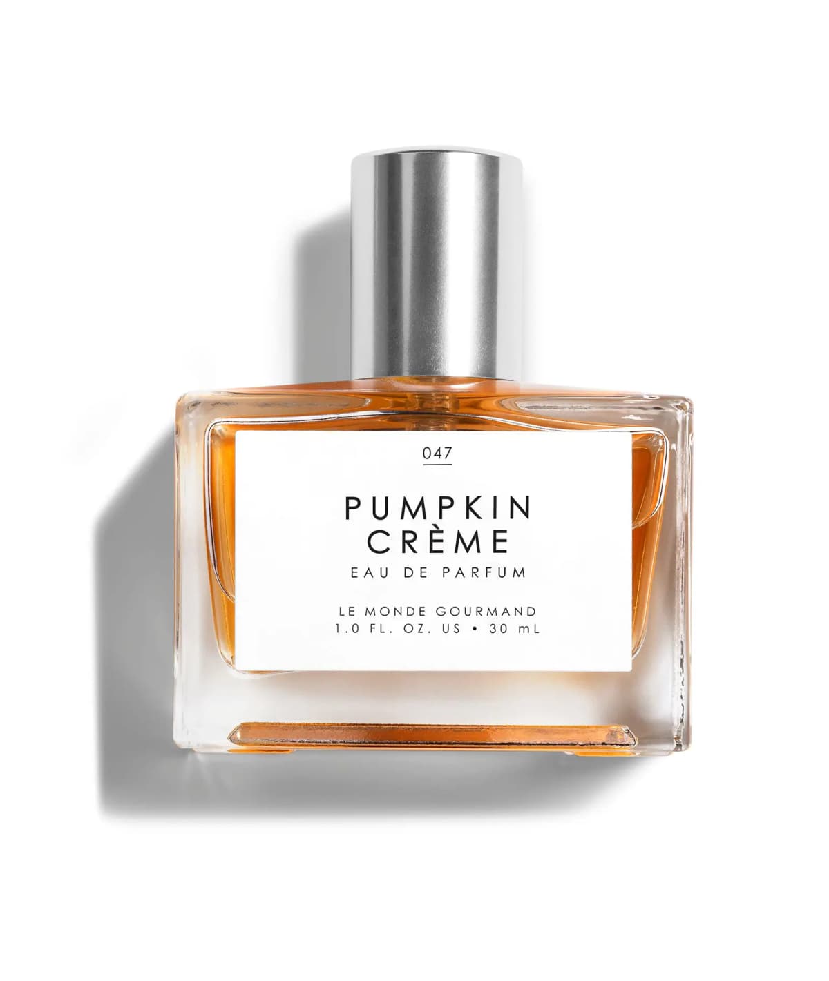 Pumpkin Crème Eau de Parfum 30 ml bottle filled with amber-orange liquid and a silver cap on white