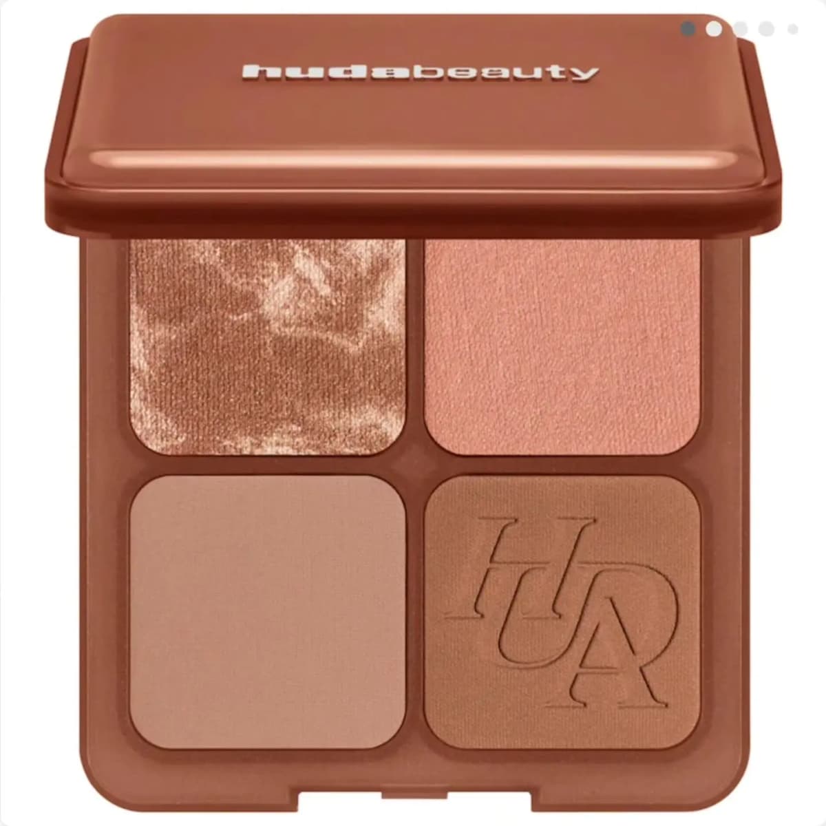 Light palette with marbled bronze, peachy pink, soft beige matte and HUDA-embossed tan bronzer in a brown case.