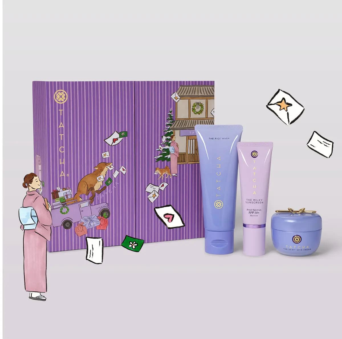 Purple Tatcha box with The Rice Wash, The Milky Sunscreen SPF 50+ and The Dewy Skin Cream; a drawn woman in a kimono