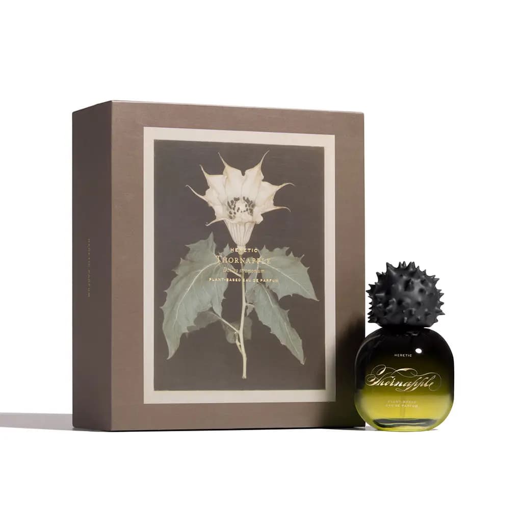 Thornapple 50ml bottle beside its taupe box printed with a white Datura stramonium flower and gold lettering.