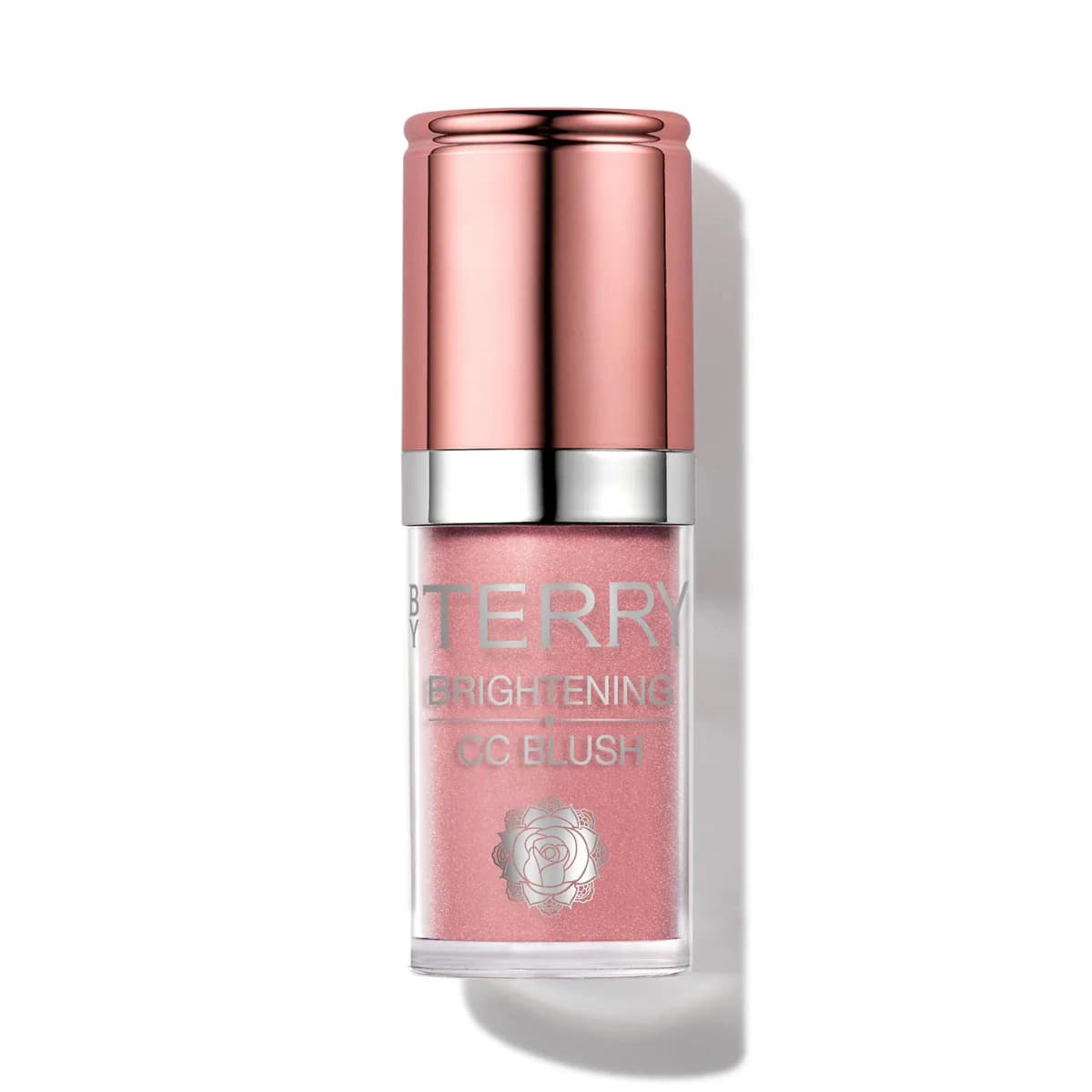 By Terry Brightening CC Blush in a soft shimmering pink, rose-gold cap and silver rose emblem, on white.