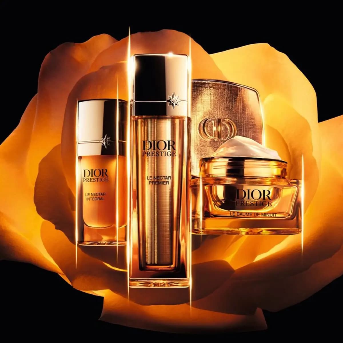 Dior Prestige Le Nectar Intégral, Le Nectar Premier and Le Baume de Minuit set against a glowing golden rose