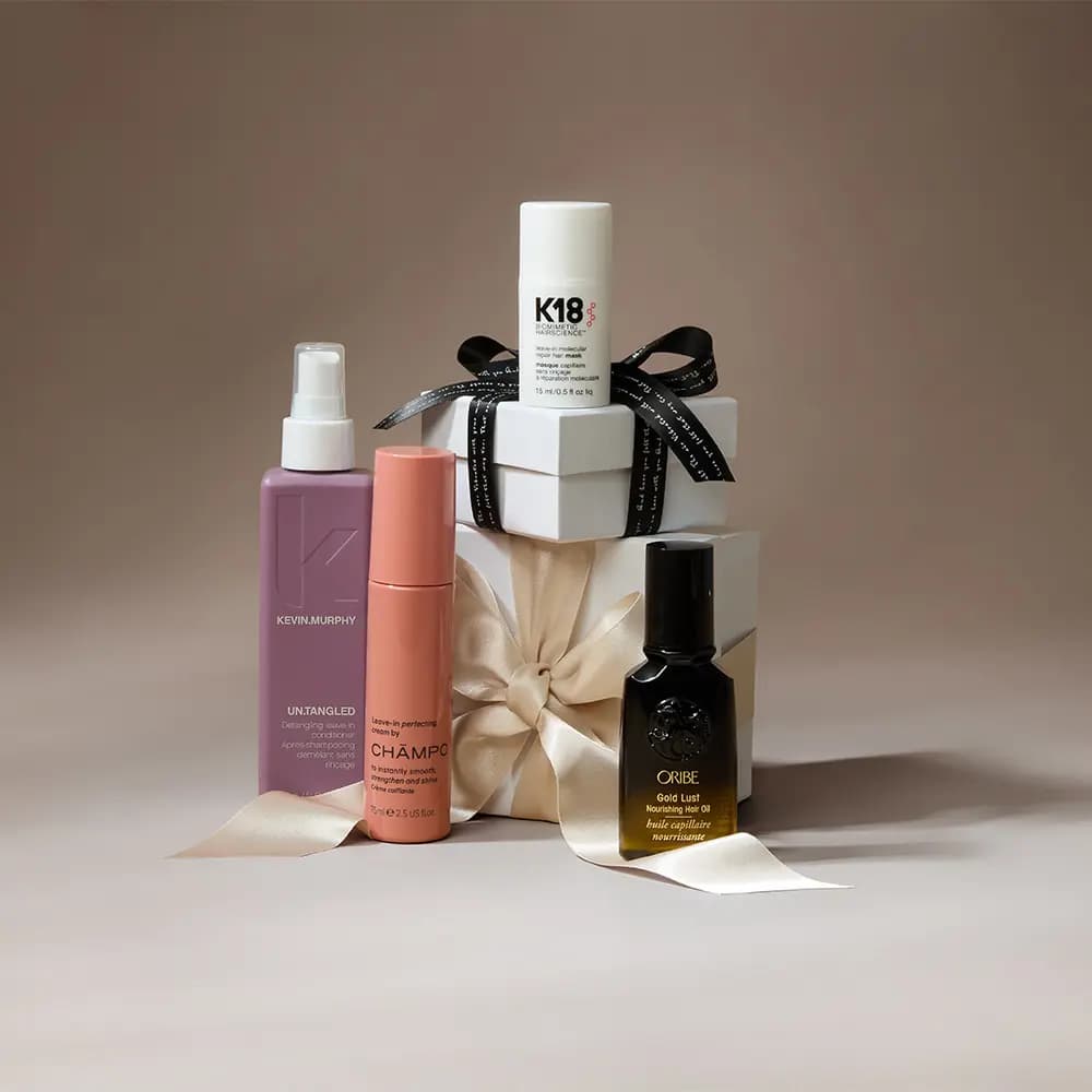 Haircare selection featuring Kevin Murphy Un.Tangled, Champo leave-in cream, K18 mask and Oribe Gold Lust oil with cream