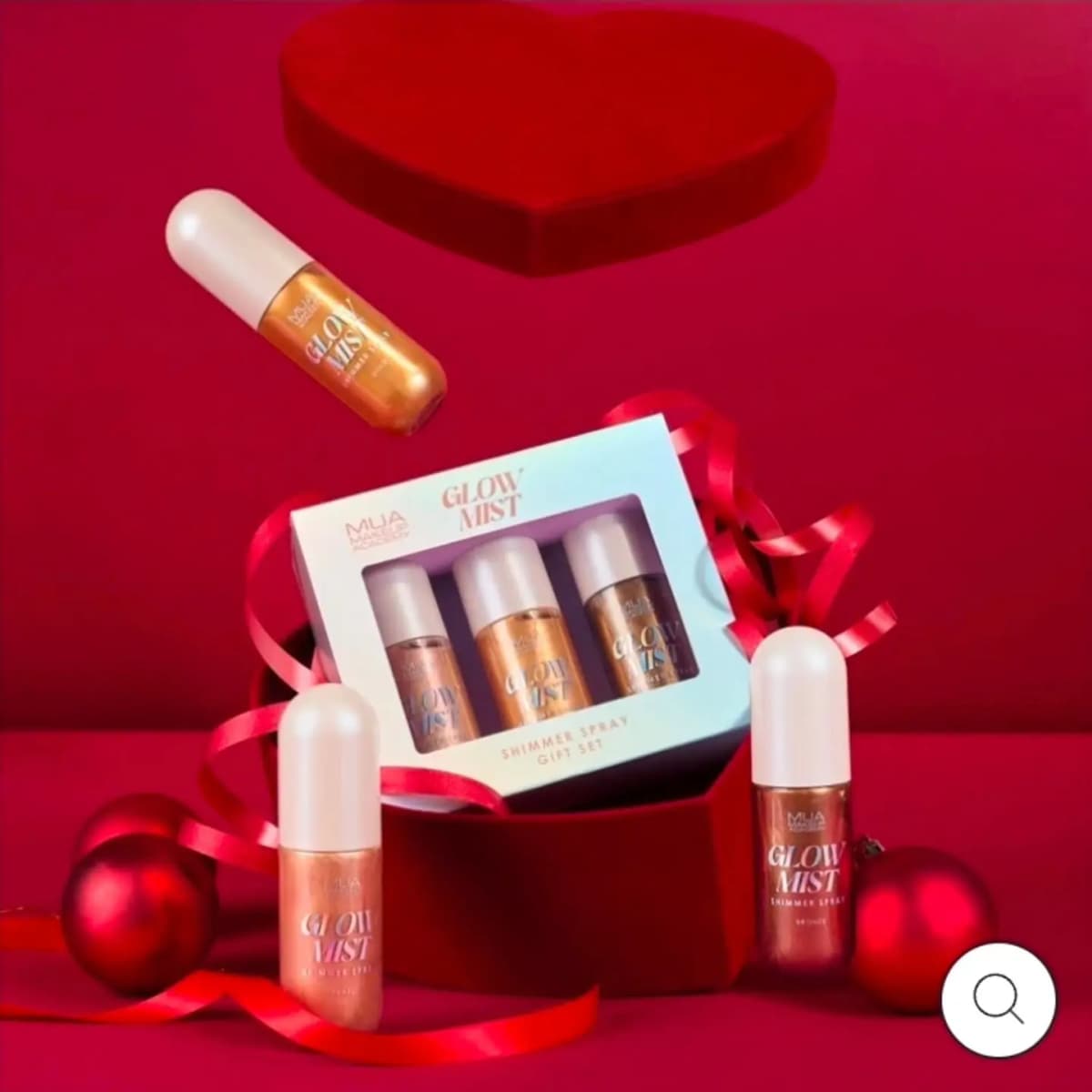 MUA Glow Mist Shimmer Spray Gift Set box in a red velvet heart box, with Pearl, Gold and Bronze bottles around it.