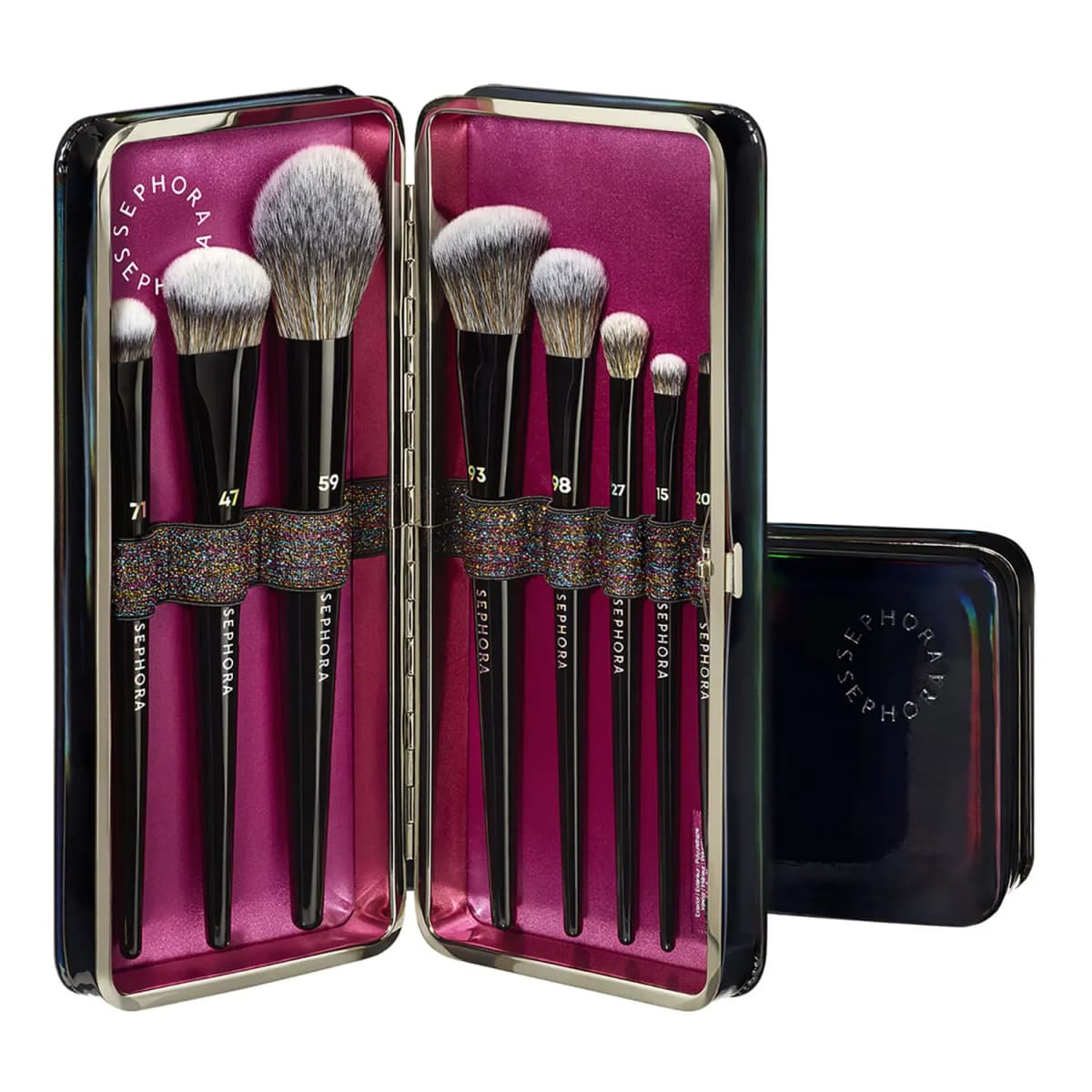 Open glossy black case with pink satin lining holding eight numbered black Sephora makeup brushes on a glitter strap