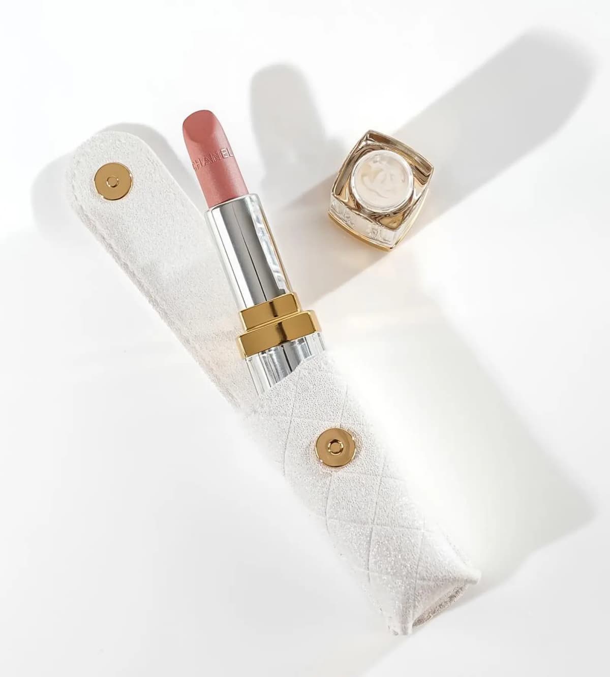 Chanel Holiday 2026 pink lipstick in its quilted white sleeve with magnetic snap