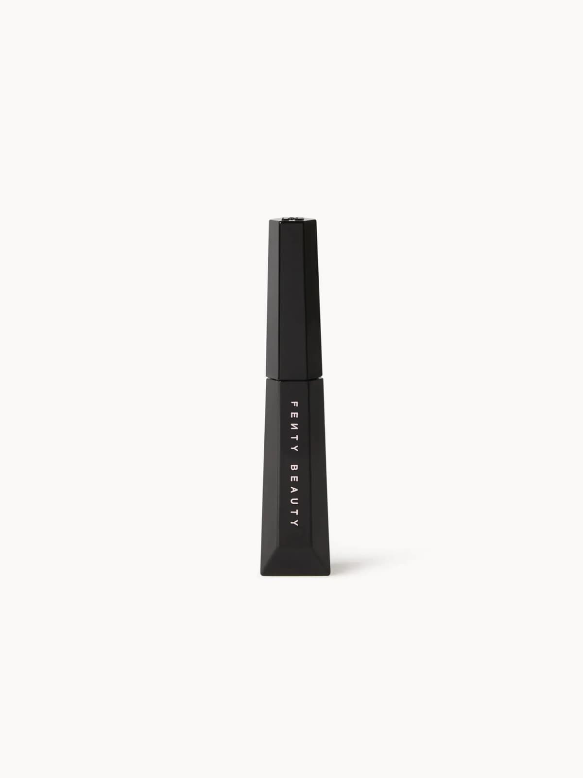 Fenty Beauty product in a tapered matte black faceted tube with vertical pink lettering