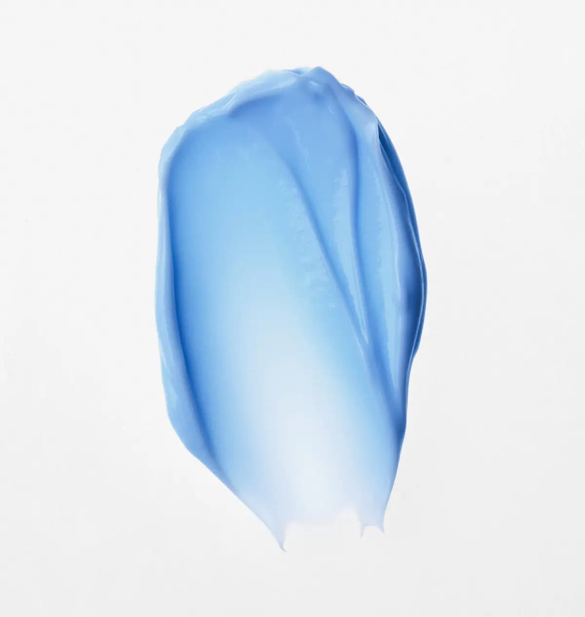 Smooth swatch of light blue moisturiser cream smeared on a white background