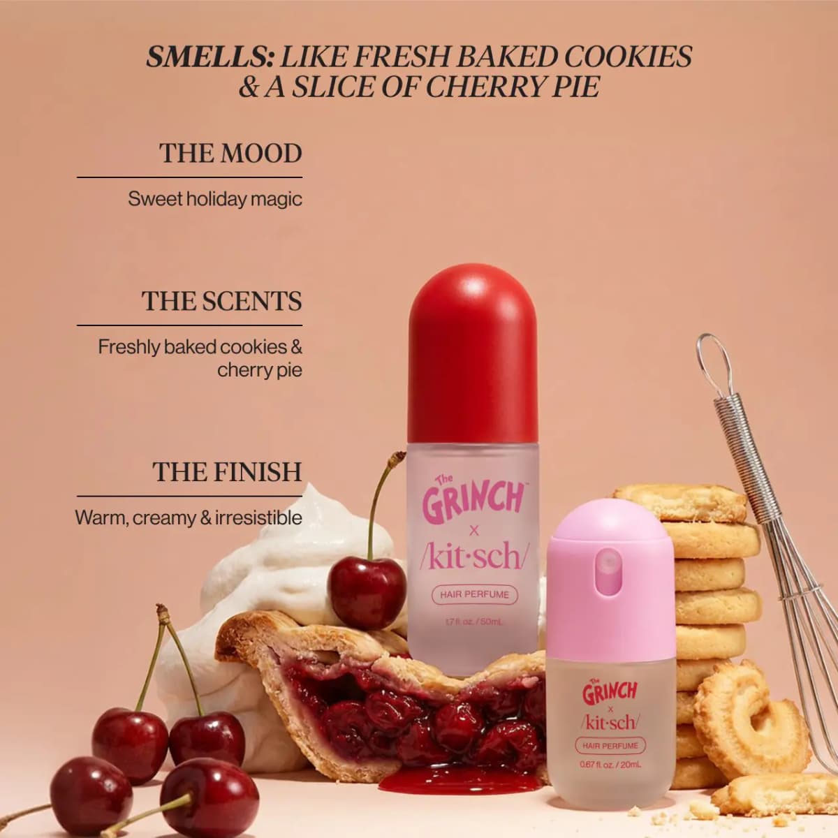 Both bottles staged with cherry pie, whipped cream, cherries, stacked butter cookies and a whisk on a peach backdrop