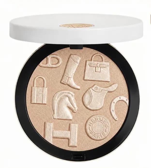 Permabrass highlighter in pale champagne, embossed with a riding boot, Kelly bag, padlock, horse head, saddle and H