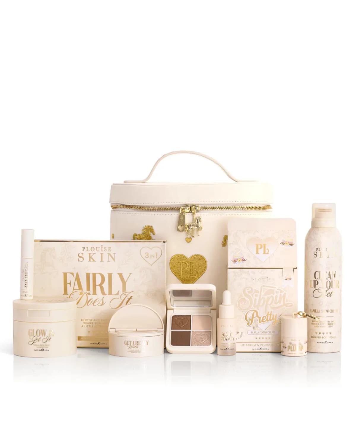 Cream vanity case with gold horse embroidery beside Vanilla Snow Cream skincare, eyeshadow quad and body foam