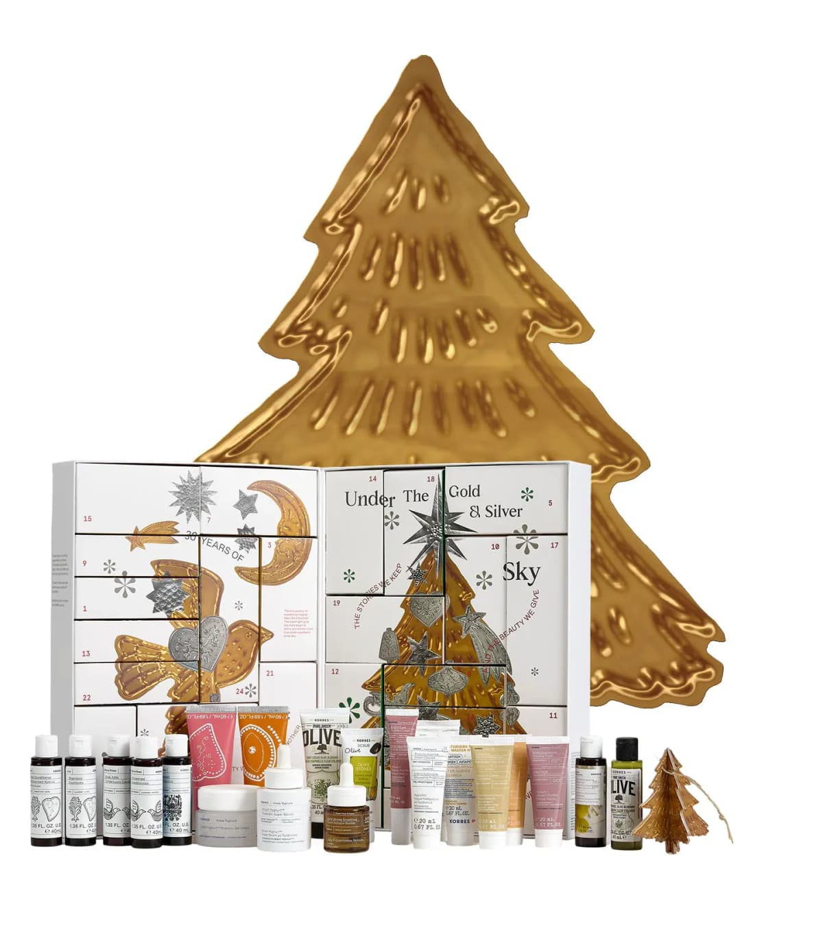 Open KORRES Advent Calendar and its products in front of a large embossed gold Christmas tree cut-out