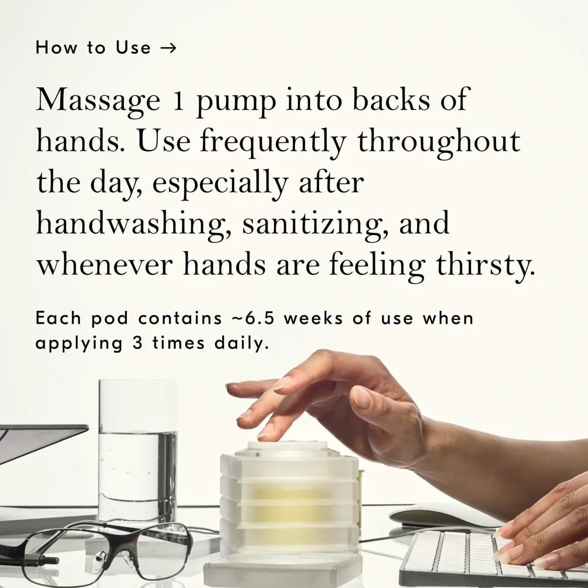 Finger pressing the dispenser pump on a desk beside a keyboard, with how-to-use instructions above
