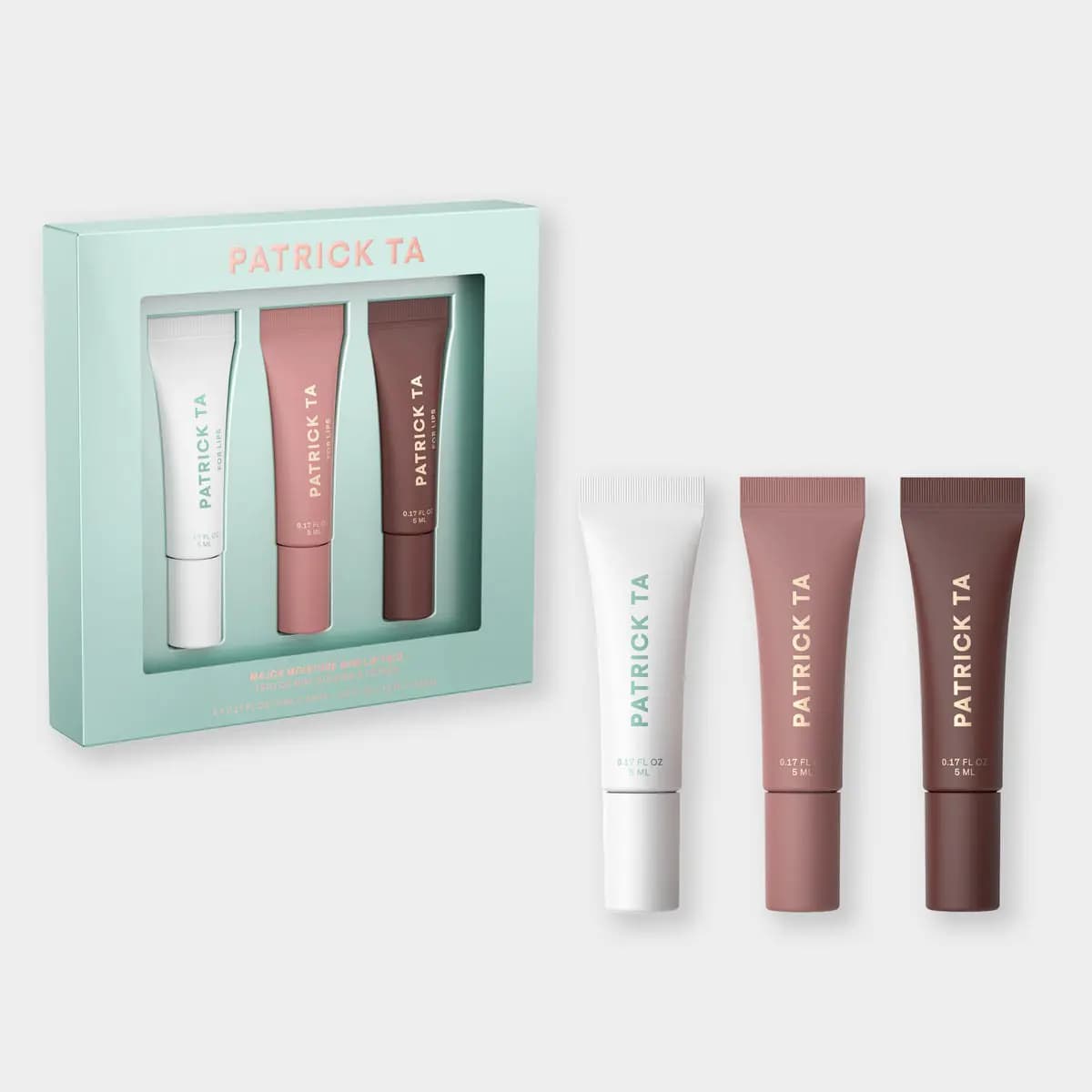 Patrick Ta Major Moisture Lip Trio: three mini lip balm tubes in white, mauve and deep brown beside a mint green gift box