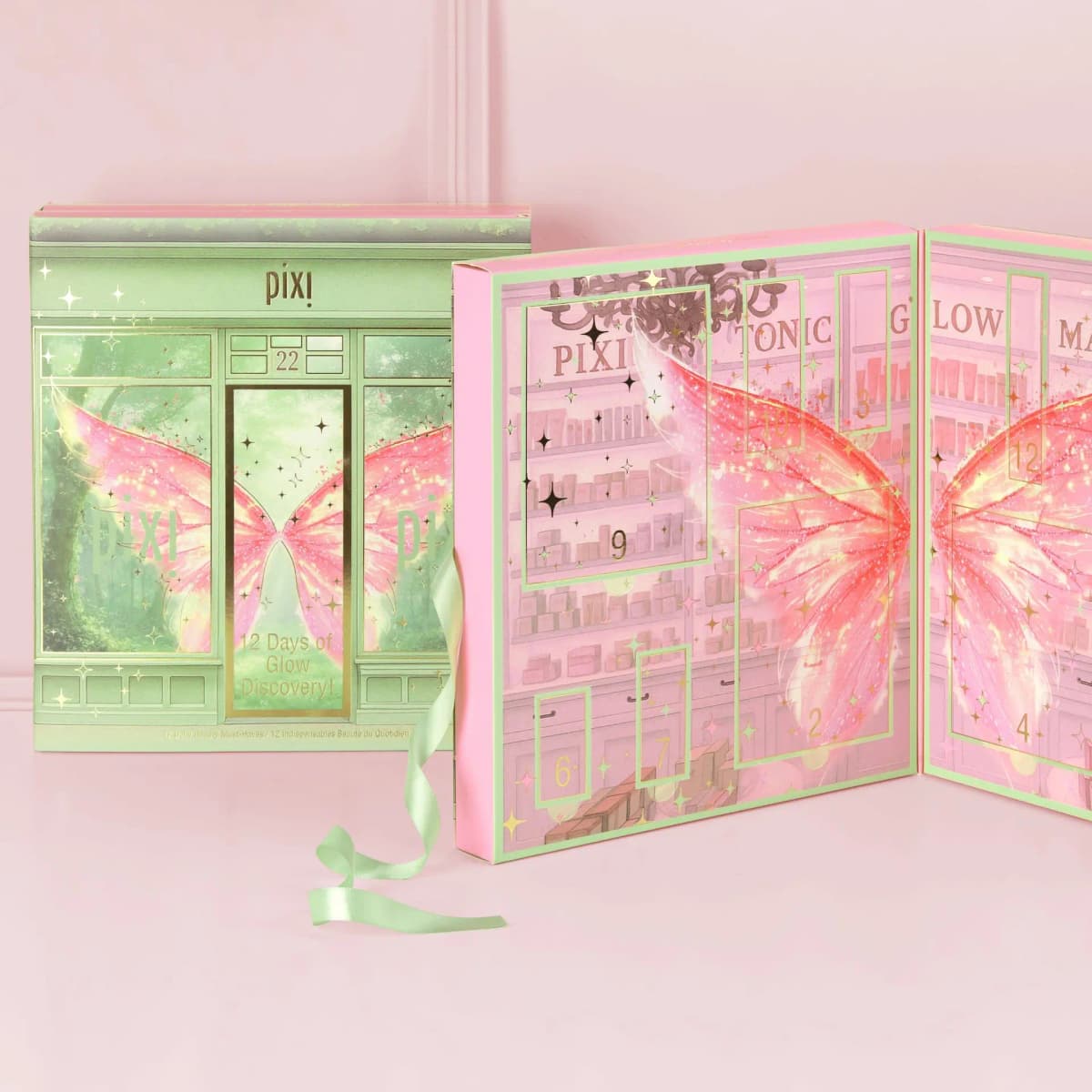 Closed mint Pixi calendar beside an open pink calendar showing numbered doors and shelves labelled PIXI, TONIC and GLOW