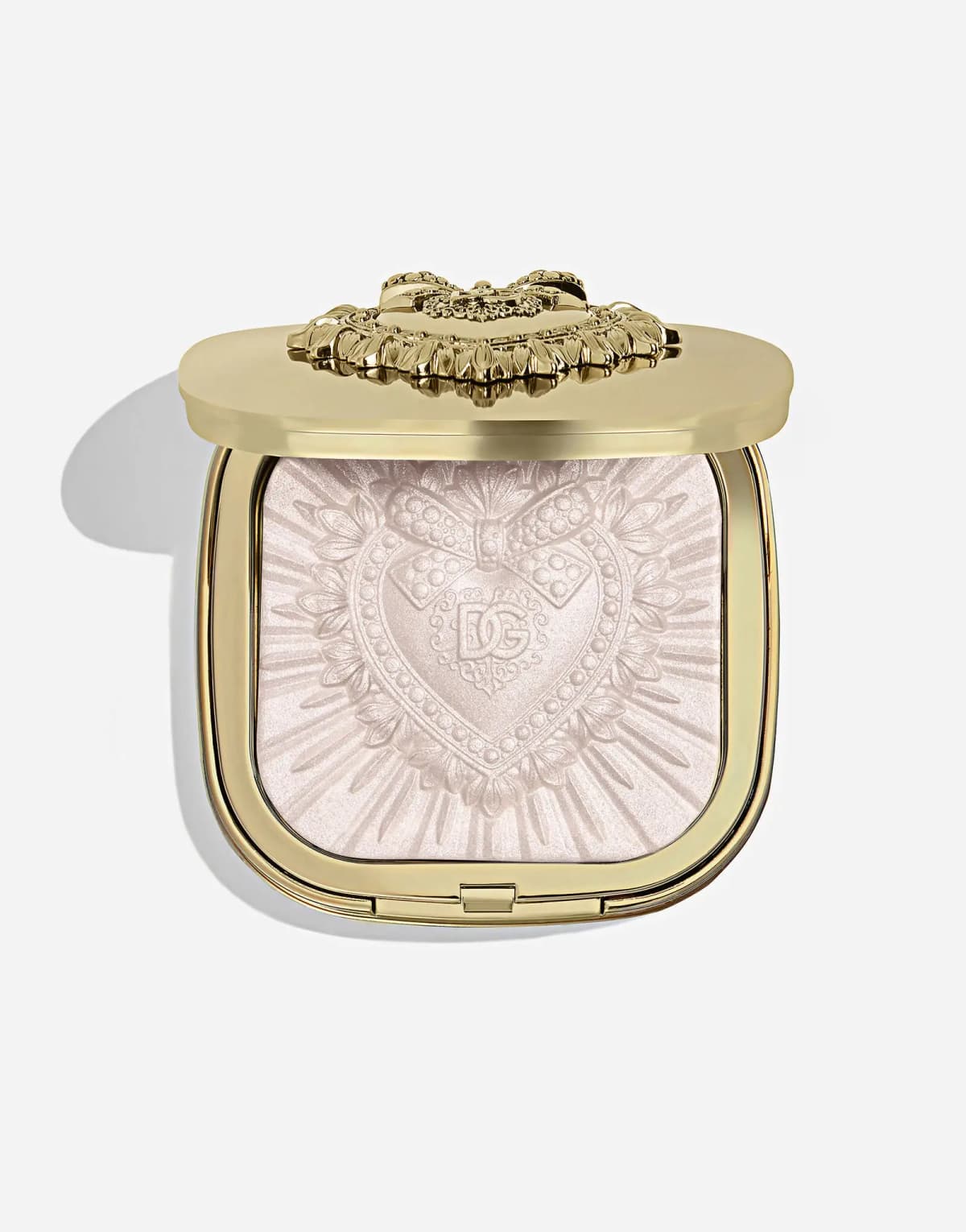 Dolce&Gabbana Everlift Luminizer powder highlighter in an open gold compact, pale pink pan embossed with a DG heart