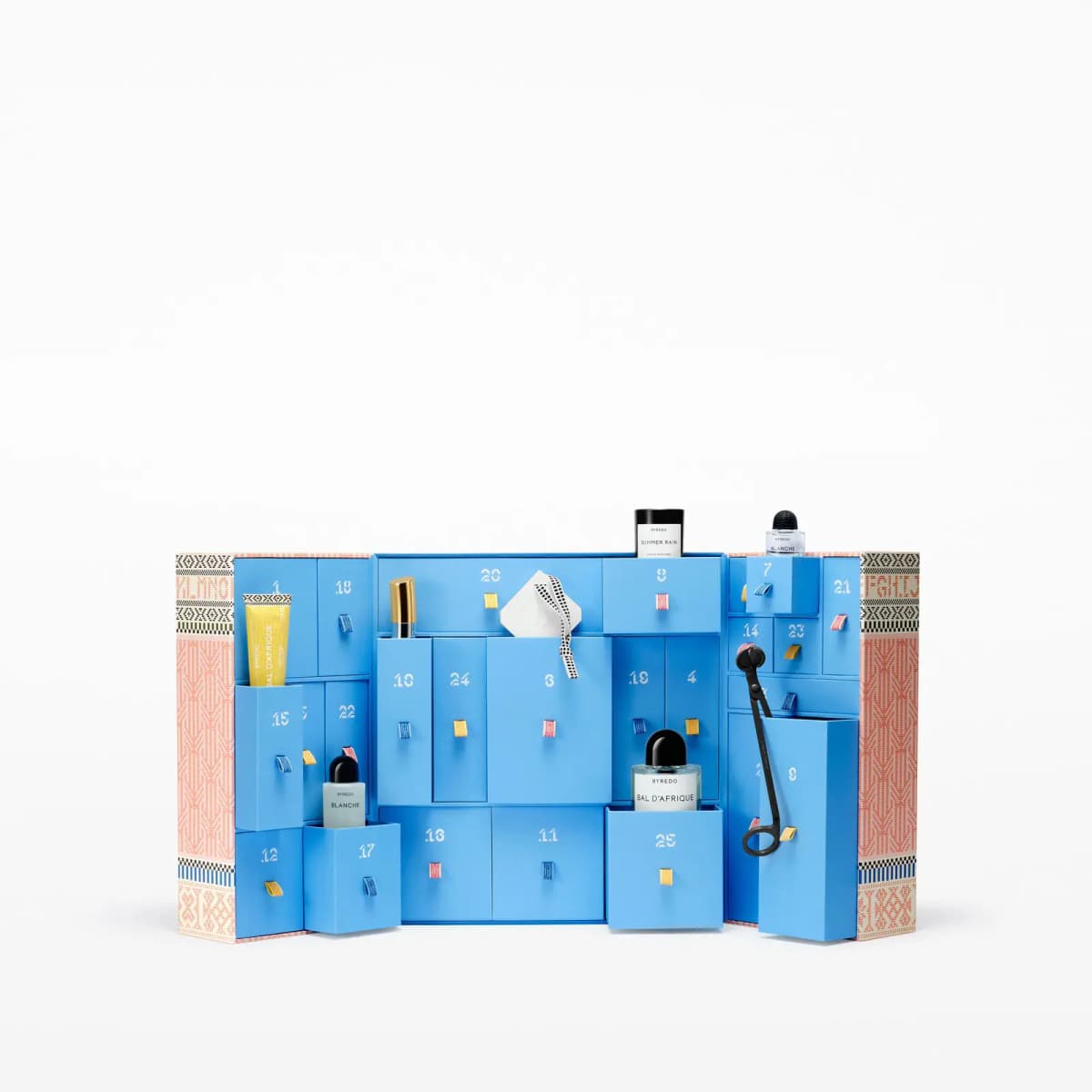 Blue drawer calendar partially opened showing miniature Byredo bottles, candle snuffer