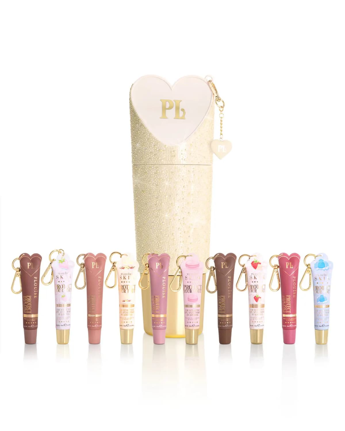 Ten Protect Your Pout tubes with clip-on hooks in front of a gold crystal cylinder topped with a cream PL heart