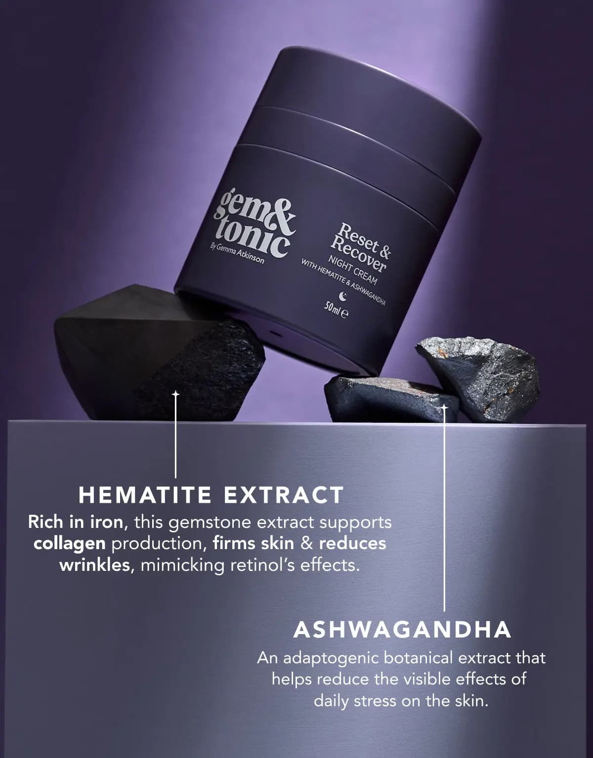 Tilted purple night cream jar resting on dark hematite stones, with hematite extract and ashwagandha benefit captions
