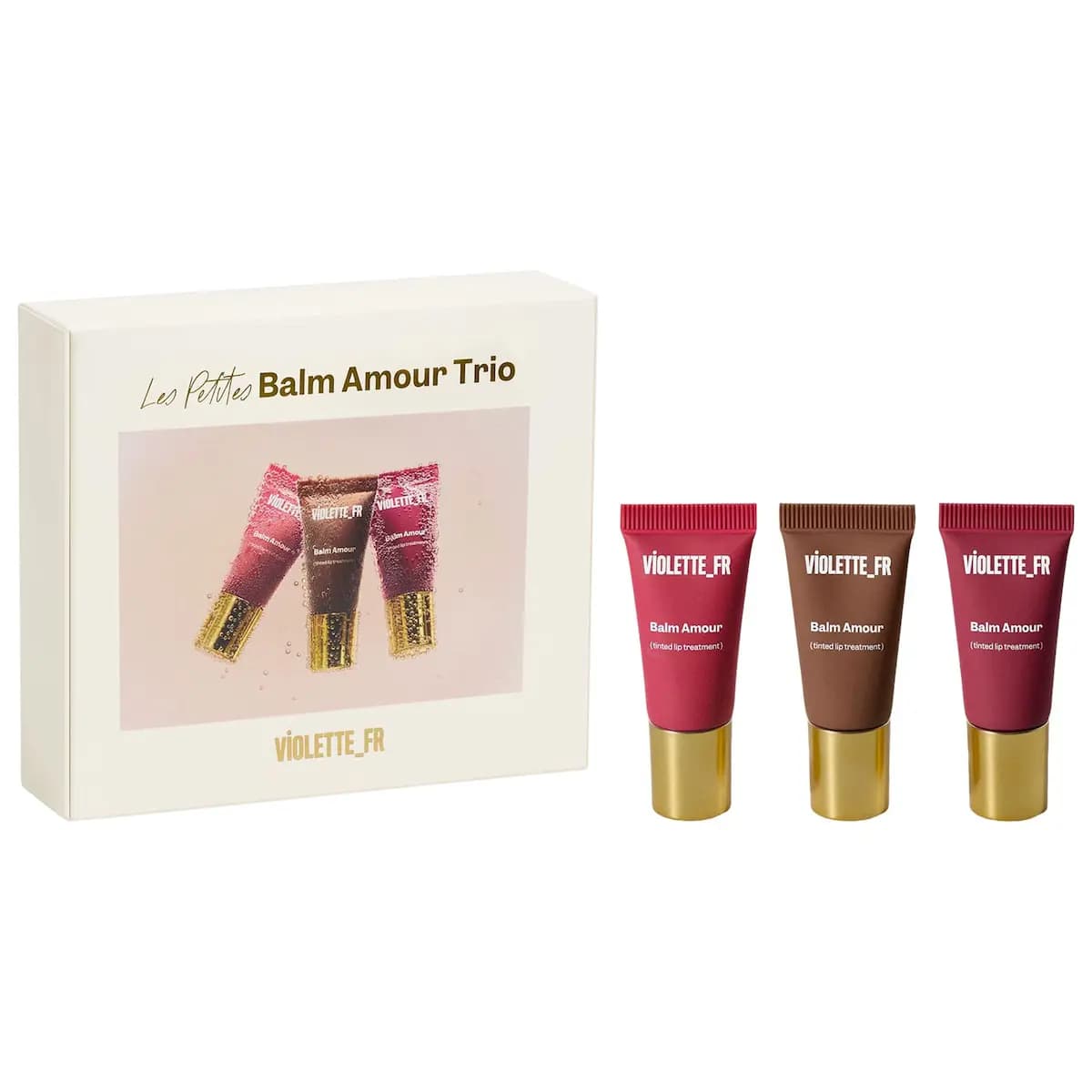Violette_FR Les Petites Balm Amour Trio box beside three mini tubes in pink, brown and berry with gold caps.
